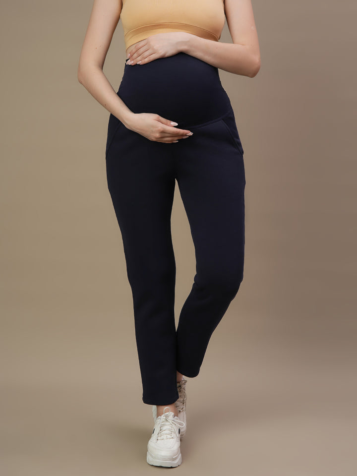 Front view of Wobbly Walk Navy Blue Maternity Fleece Pants featuring an over-belly, elastic-free waistband