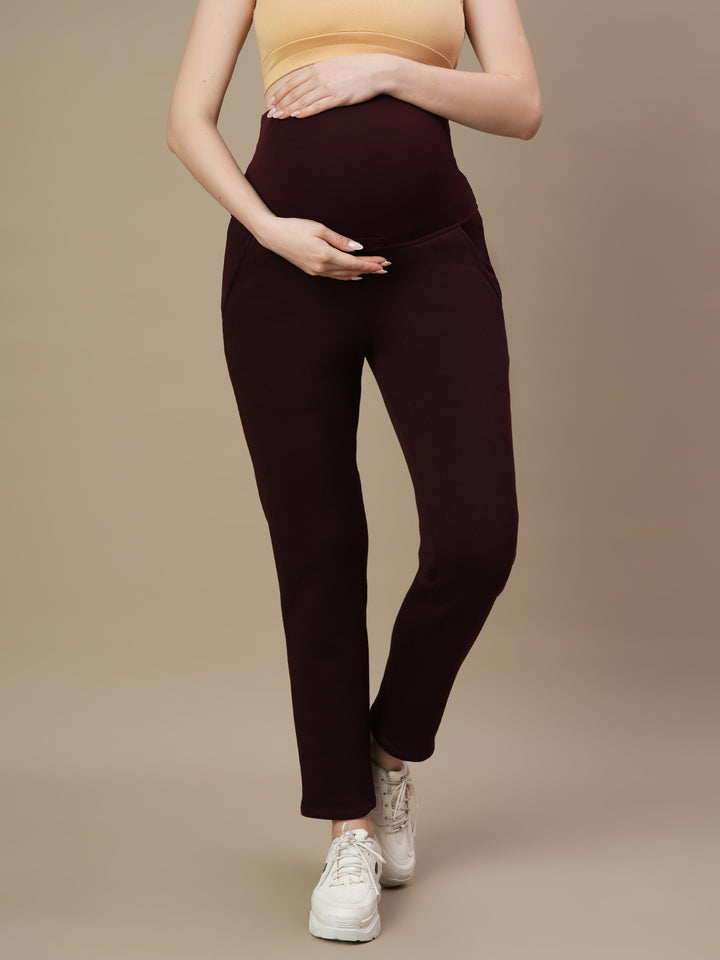 Front view of Wobbly Walk Wine Berry Maternity Fleece Pants featuring an over-belly, elastic-free waistband